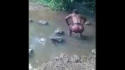 คลิปโป๊ African hoe bathing in the river and getting fuck by strangers Part 1